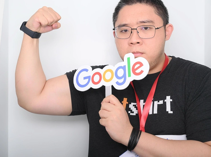 Kevin Jonas holding a Google sign at Google Search Central Live