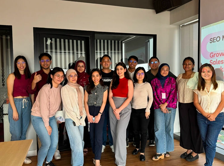 Group photo of SEO training participants with Kevin Jonas